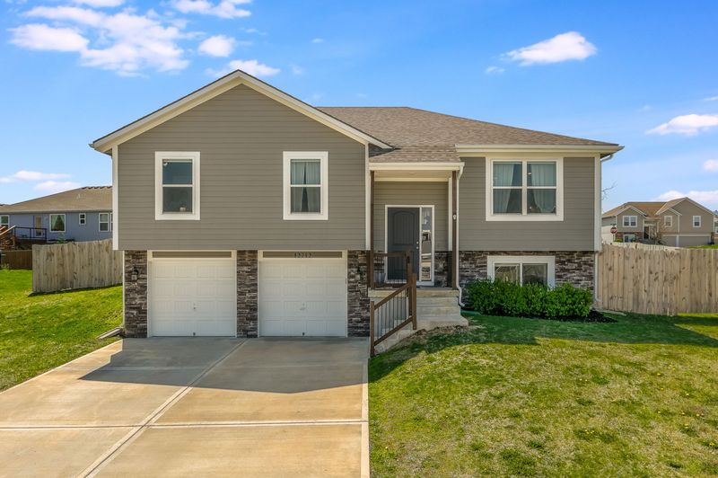 Front exterior of 12712 Belmead Ave, Grandview, MO, a home sold by Carol Tran Reynolds