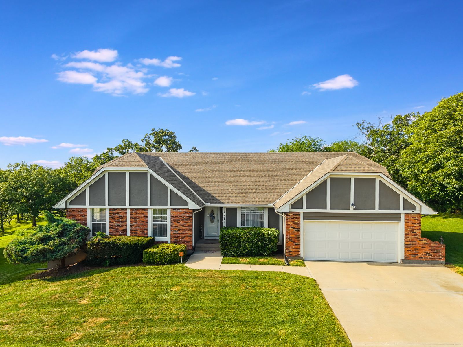 Front exterior of 7004 E 143rd St, Grandview, MO, a home sold by Carol Tran Reynolds